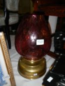 A brass oil lamp with cranberry glass shade - Font has been drilled for electric so won’t hold fuel