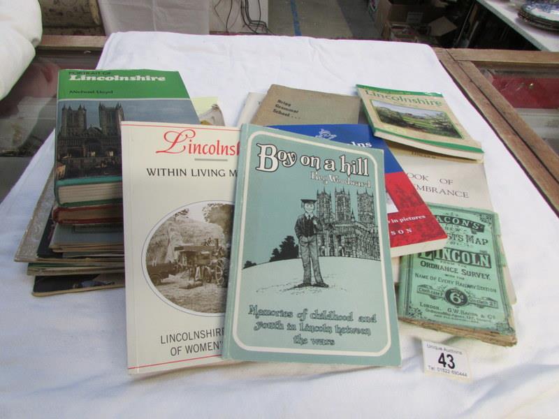 A mixed lot including books and maps of