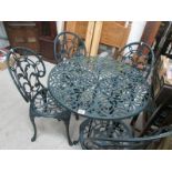 An alluminium garden table and 4 chairs