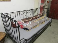 An Ikea wrought iron day bed