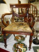 A Georgian mahogany carver chair with deep buttoned leather seat
Condition
The chair came from