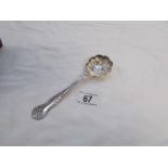 An ornate silver plated spoon