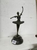 A bronze figure of a ballerina