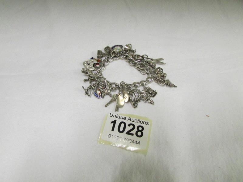 A silver charm bracelet with approximately 22 charms
Condition
Weight is 55gms