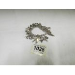 A silver charm bracelet with approximately 22 charms
Condition
Weight is 55gms