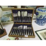 A cased set of fish knives and forks