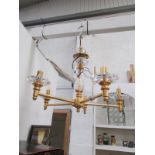 A 6 light gilded and glass chandelier