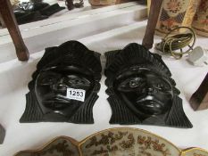 2 carved Nigerian wall masks
