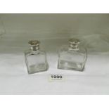 2 scent bottles with monogrammed tops