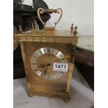 A brass mantel clock with battery moveme