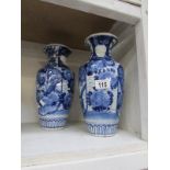 A pair of blue and white vases (one has