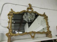 A gilt framed wall mirror