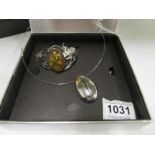 A silver bracelet marked 925 with amber