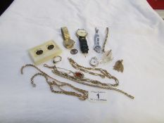 A mixed lot of costume jewellery and watches