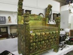 A gilded Egyptian throne