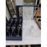 A boxed set of 6 cut glass wine glasses,