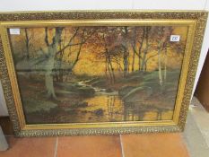 A gilt framed print, brook in forest