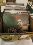 A box of LP records including Queen, Jethro Tull etc