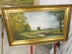 A gilt framed oil on board 'Green Pastures' signed S Vokes, image 75cm x 39cm, frame 90cm x 55cm