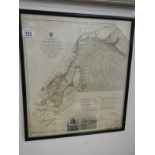 A framed and glazed official Admiralty map