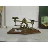 A set of brass letter scales and weights