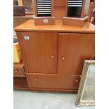 A teak TV cabinet