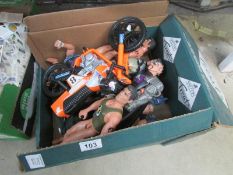 A box of Action man type figures