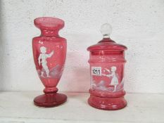 A cranberry glass Mary Gregory style vas