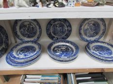 A mixed lot of blue and white plates and