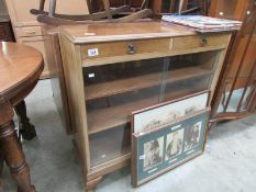 A glazed bookcase