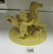 A Dichwald figure of a boy with horse, a