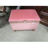 A pink ottoman