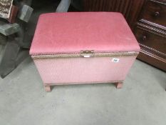 A pink ottoman