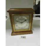 A Garrard mantel clock with platform esc