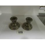 A pair of silver candlesticks, hallmarke