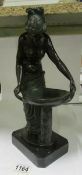 A bronze classical lady at pedestal bowl