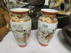 A pair of signed Oriental vases