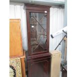 A mahogany astragal glazed cabinet