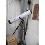 A Jessops reflecting telescope with star