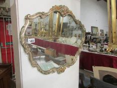A floral framed mirror