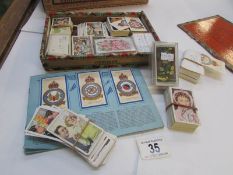 A quantity of loose cigarette cards