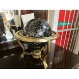 A celestial globe on brass stand and wit