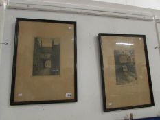 A pair of framed and glazed etchings of