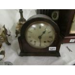 An oak mantel clock