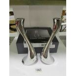 A pair of boxed Georg Jensen candlestick
