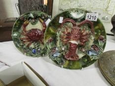 A pair of majolica crab and lobster plaq