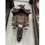 A Black Forest cuckoo clock with pendelu