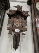 A Black Forest cuckoo clock with pendelu