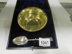 A cased silver presentation bowl and sil