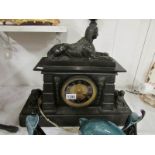 A Victorian black marble mantel clock su